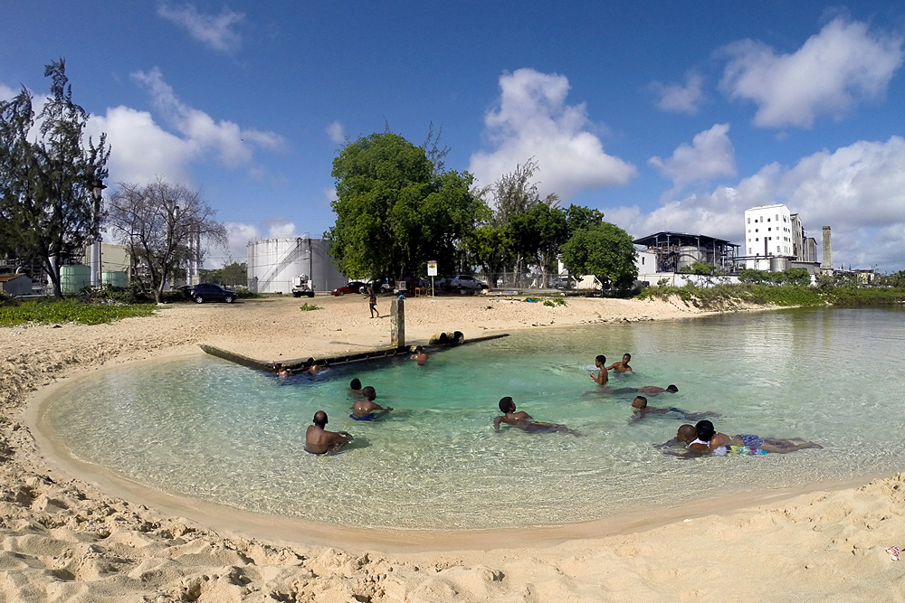 Locals enjoying a relaxing bath in the warm water.